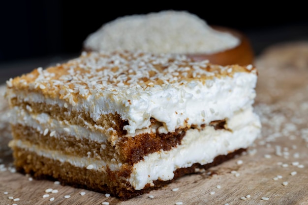 Creamy cream and caramel cakes sprinkled with sesame