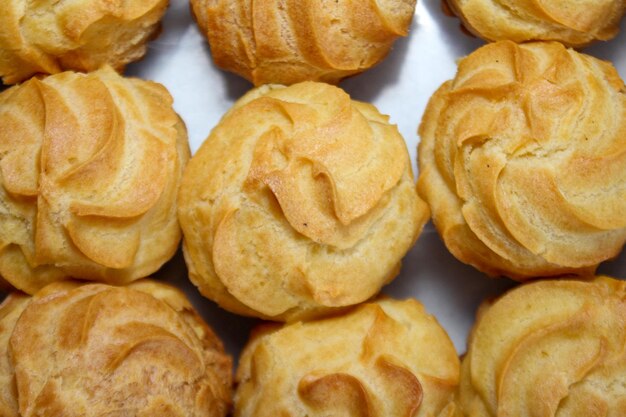 Creamy eclairs in Indonesia called kue sus filled with cream puffs