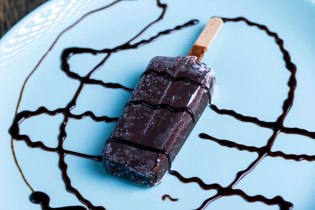 Creamy ice cream in milk chocolate on a plate