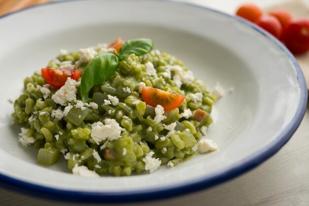 Creamy Italian risotto with spinach and cheese Traditional Italian recipe