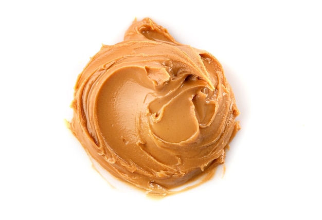 Creamy peanut butter isolated on white