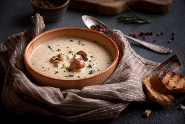 Creamy porcini mushroom soup in a rustic bowl