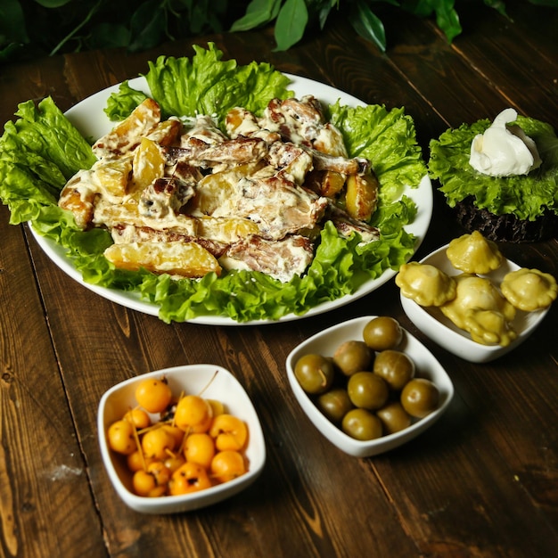 creamy potato and meat dish with side dishes