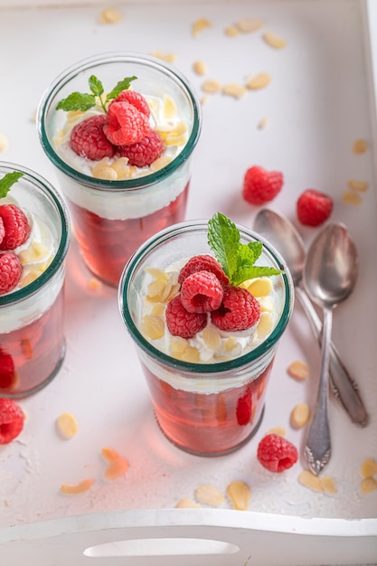 Creamy red jelly with raspberries cream and almonds