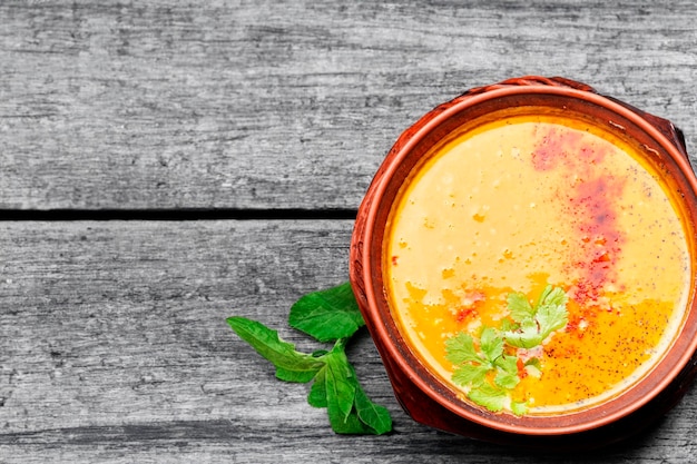 Creamy yellow lentil soup topped with golden croutons