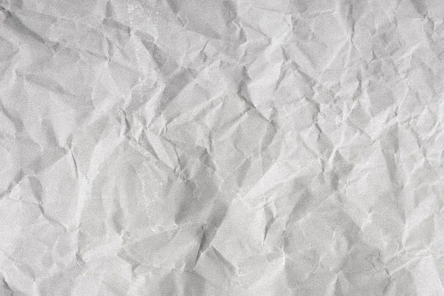 Creased paper background texture Gray color Full frame