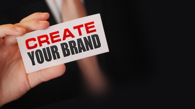 Create your brand message on card in businessan hand business
startup concept