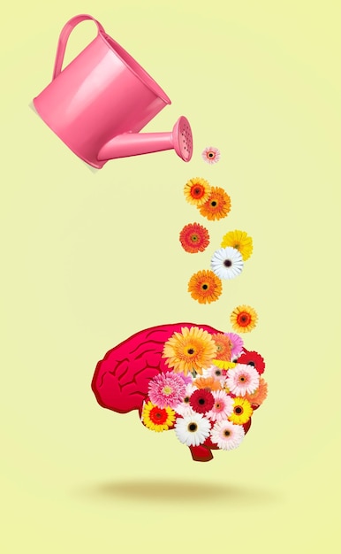 Foto creatief minimaal idee gemaakt van menselijk brein met bloemen en gieter. bewustzijn van geestelijke gezondheid,
