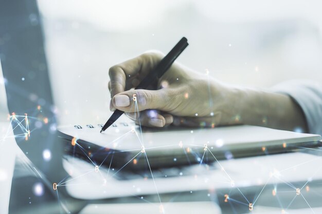 Creatieve abstracte technologie schets en hand schrijven in Kladblok op achtergrond met laptop toekomstige technologie en AI concept Dubbele belichting