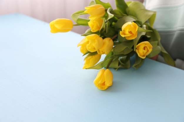 Creating a bouquet of yellow tulips