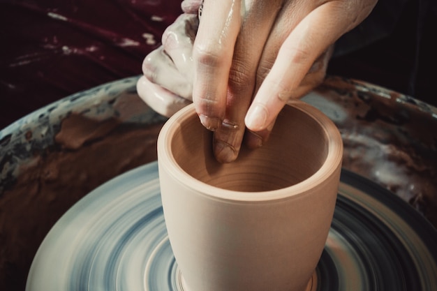 Creating ceramic products of white clay closeup