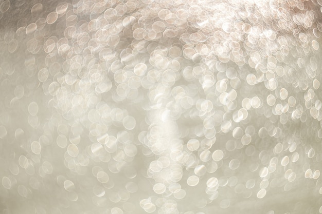 Creative background image, light transparent drops of water in blur. Blurred bokeh on light background.