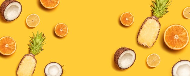 Creative background made of summer tropical fruits