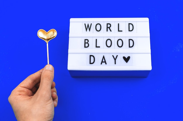 Creative background for world blood donor day with text lettering sign for international holidays