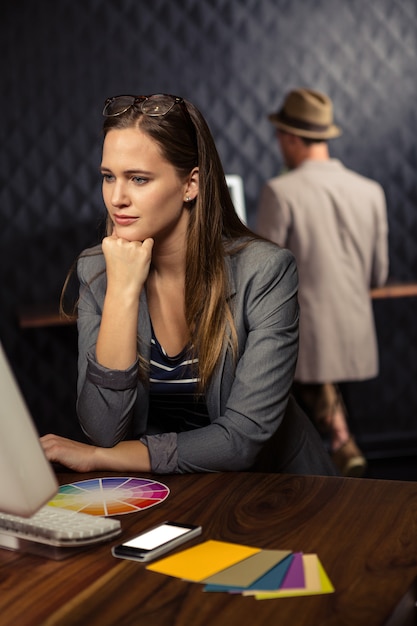 Creative businesswoman using computer 