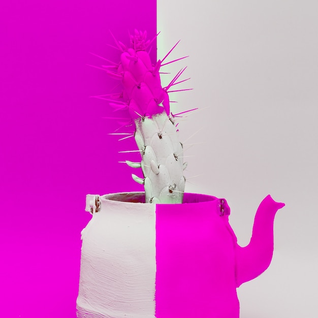 Photo creative cactus in a teapot. minimal art design