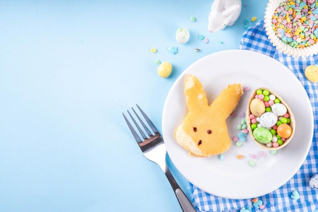 Photo creative childrens breakfast pancakes in shape of easter bunny