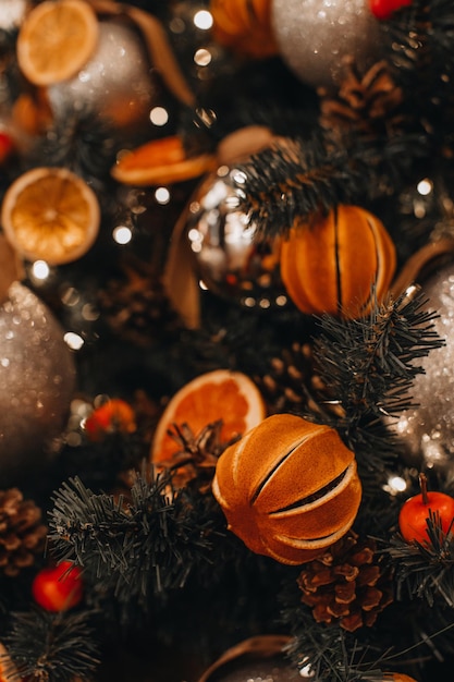 Creative Christmas tree decorated with dry oranges pine cones mandarins Winter season in holiday