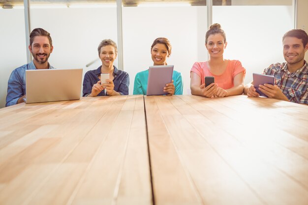 Creative colleagues with laptop and digital tablet 