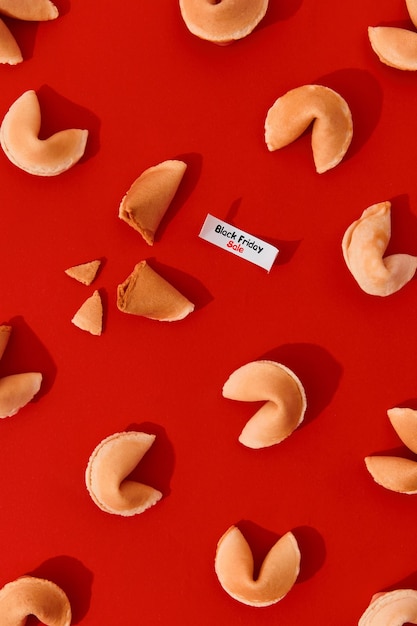 Photo creative composition for black friday shopping sale fortune cookies on red