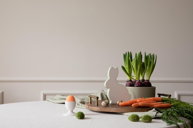 Creative composition of dinning room interior with copy space round table wooden trace orange carrot