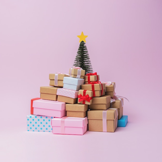 Creative composition with Christmas tree and gift boxes