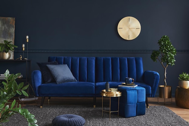 Creative compositon of modern living room interior design with glamour blue sofa metal shelf coffee table and elegant home accessories Dark blue wall Home staging Template Copy spacexA