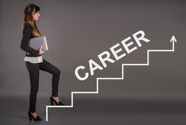 Creative concept about success career ladder business woman\
with a laptop