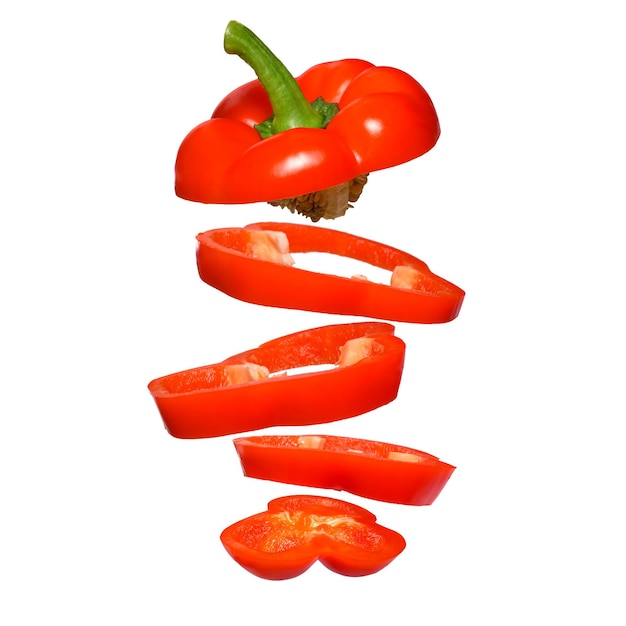 Creative concept with flying red paprika Sliced floating pepper isolated