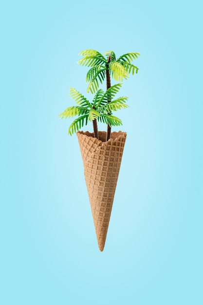 Creative concept with palm tree in ice cream cone on bright background Minimal tropical summer background