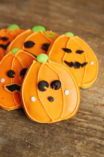 Creative cookies for Halloween party on wooden background