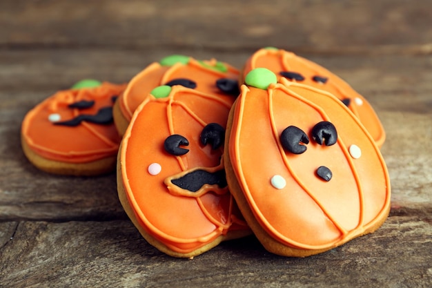 Creative cookies for Halloween party on wooden background