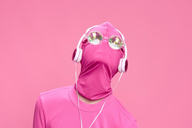 Creative crazy pink photo on a pink background with pink clothes and accessories cyberpunk concept and conceptual art photography