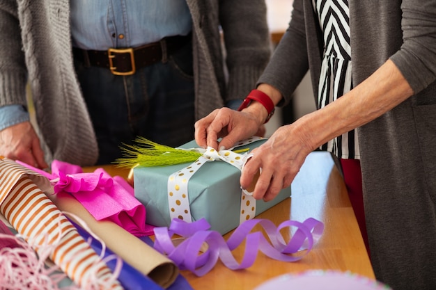 Creative decorations. Top view of a beautifully decorated present box lying on the table