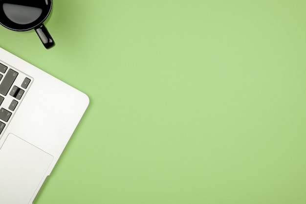 Creative design mockup set of workspace desk with cup of coffee and notebook. Copy space colored background