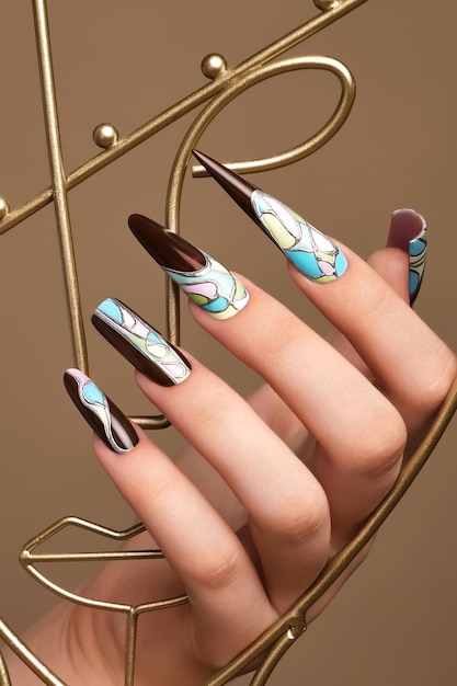 Photo creative design of nails on female hands art manicure