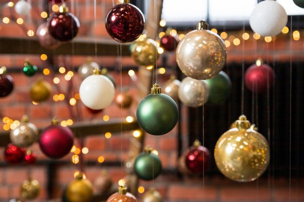 Creative festive composition with string on blurred background.Winter concept. Christmas tree decorations, colorful balls.Christmas baubles.Cafe, Restaurant,Street decorations.Happy new year