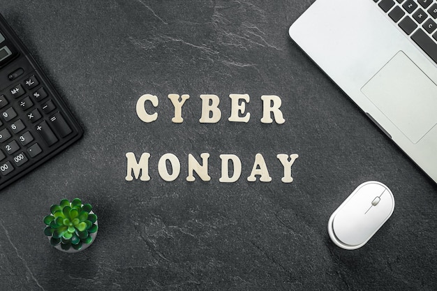 Creative flat lay promotion composition cyber monday text on a black background