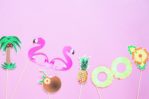 Creative flat lay of summer concept on pink colour background