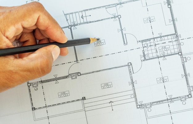 Creative flat lay top view blueprints architectural flat
project plan on decorator white table workspace blueprints
background copy space conceptxa