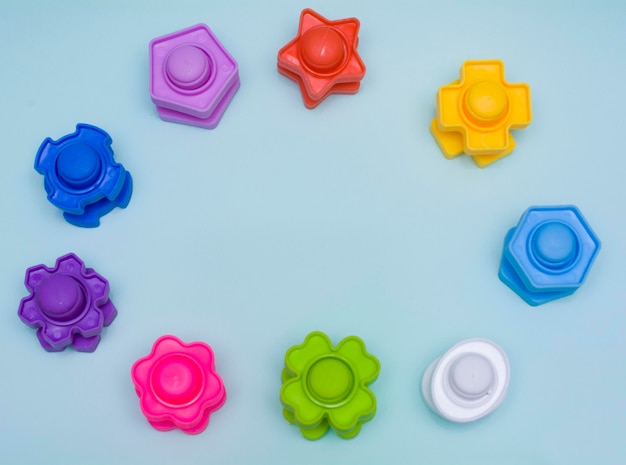 Creative flat lay view from above Children's educational toy bolts made of plastic