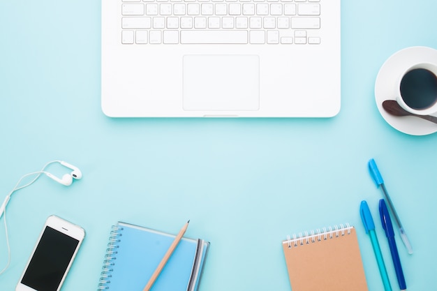 Creative flat lay of workspace with stationery, mobile device and cup of coffee, Business concept