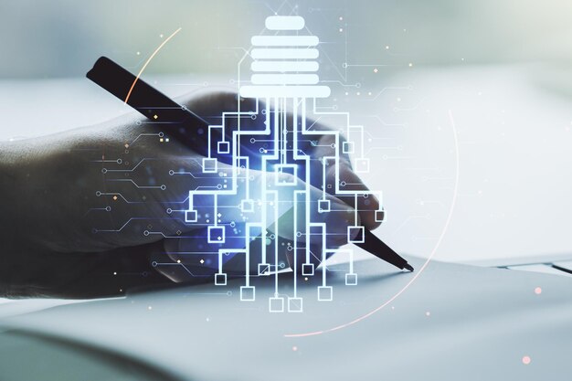 Creative idea concept with light bulb and microcircuit illustration and man hand writing in notebook on background Neural networks and machine learning concept Multiexposure