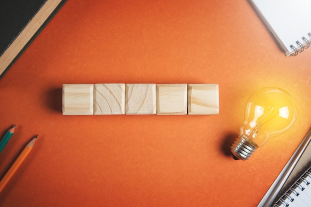 Creative idea innovation concept Wooden cubes and lightbulb mockup