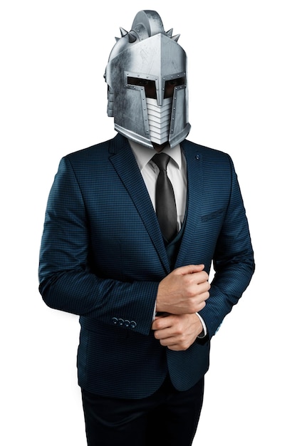 Creative image a man in a suit of a businessman a knight's helmet on his head on a white background The concept of a modern hero overcoming difficulties crisis management magazine style