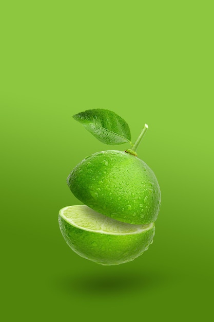 Creative layout made from green lime fruit and leaves isolated o