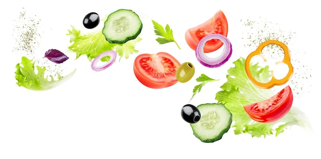 Creative layout made of tomato slice, onion, cucumber and lettuce leaves in the air