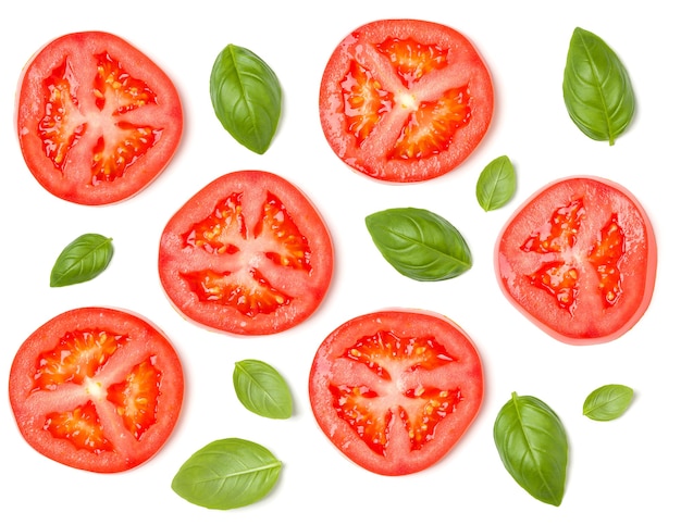 Creative layout made of tomato slices and basil leaves