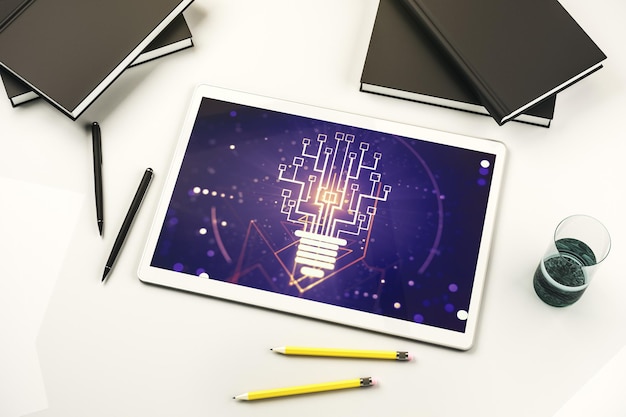 Creative light bulb with chip hologram on modern digital tablet screen artificial Intelligence and neural networks concept Top view 3D Rendering