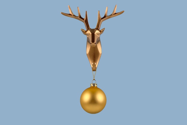 Photo creative merry christmas and new year concept golden deer head with christmas ball on blue background minimal design with copy space greeting card